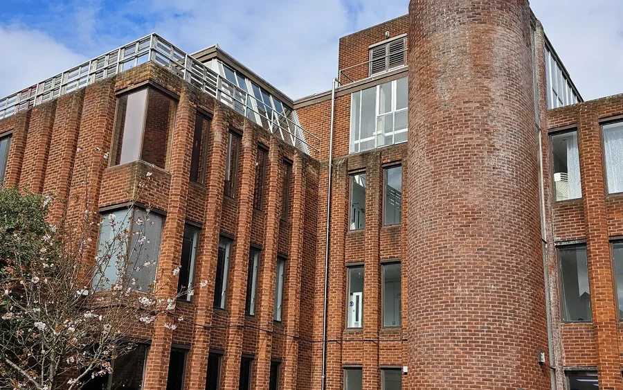 Large multi-let red-brick office building with a circular stair-tower in central Norwich, appraised by AXIOS for change of use to residential